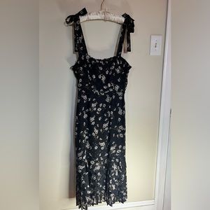 Lulu’s black and white floral midi dress with flair bottom.